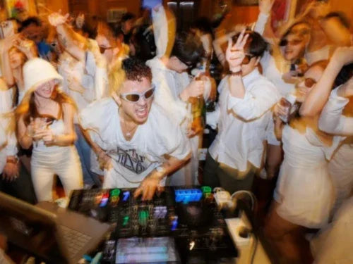 Young adults enjoying a coffee clubbing or day party event in Singapore with a DJ and specialty coffee.